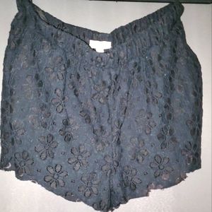 Black shorts with eyelet detailing